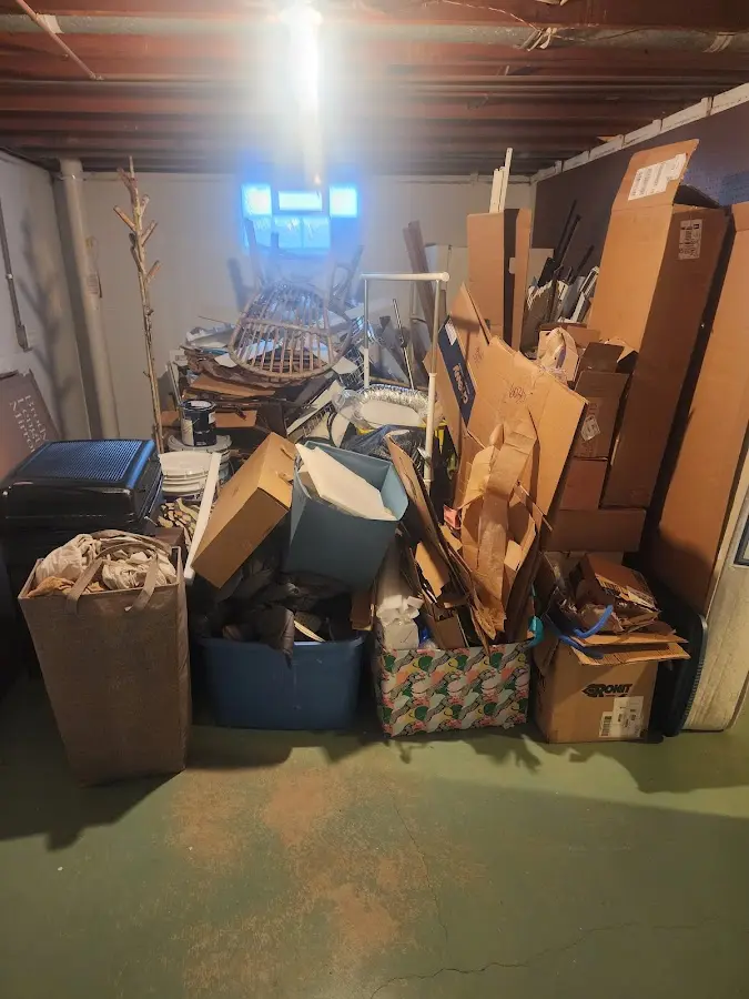 Roll-off dumpster container at job site for 2 Yard Dumpster Rental in North Muskegon